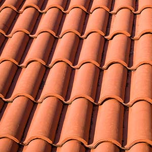 Chandler's Roofing Tile Roofing - Close up of red spanish tile shingles