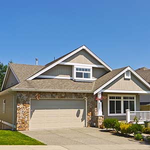 Chandler's Roofing Roofing - house with asphalt gray shingled roof